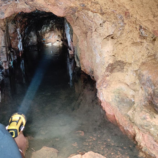 Inspecting a historical adit at Waharaka Exploration Licence